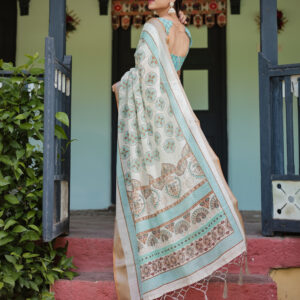 elegant beige linen saree with aqua motifs