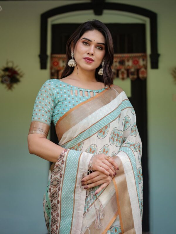 elegant beige linen saree with aqua motifs